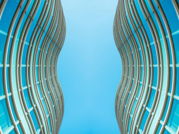 underside panoramic and perspective view to steel blue glass high rise building skyscrapers, business concept of successful industrial architecture