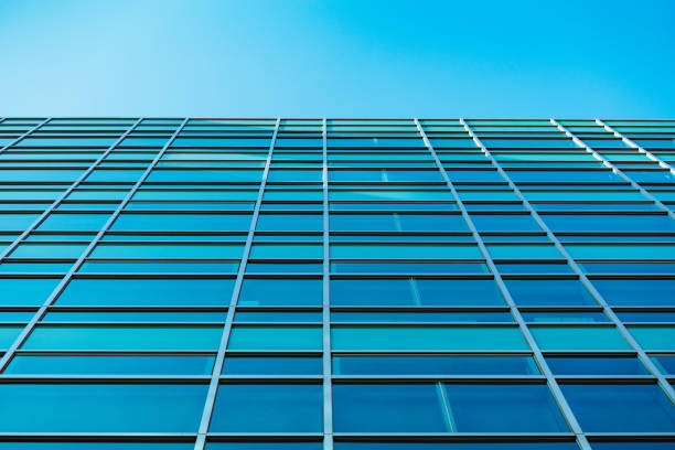 istock underside panoramic and perspective view to steel blue glass high rise building skyscrapers, business concept of successful industrial architecture 1296180953