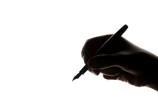 Woman's hand holding a fountain pen.