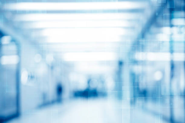 istock Abstract blurred interior of corridor clinic background in blue color , blurry image 1296182258