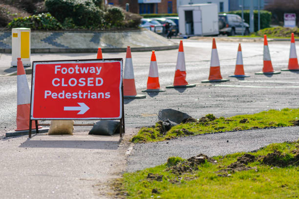 istock Sign directing pedestrians away from a closed footpath 1296182684