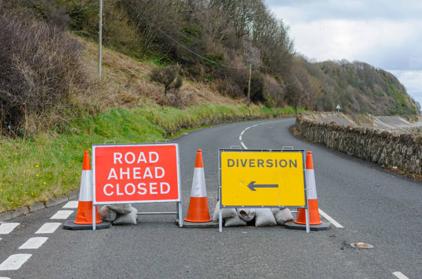 istock Road Closed and diversion signs on a coastal road 1296183565
