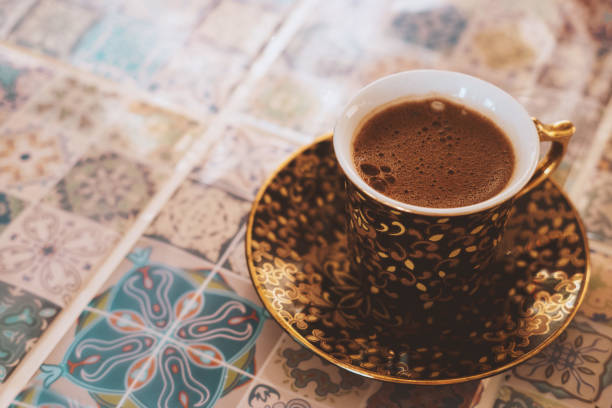 istock close-up Turkish strong coffee cup on a blurred background oriental tiles. 1296185123