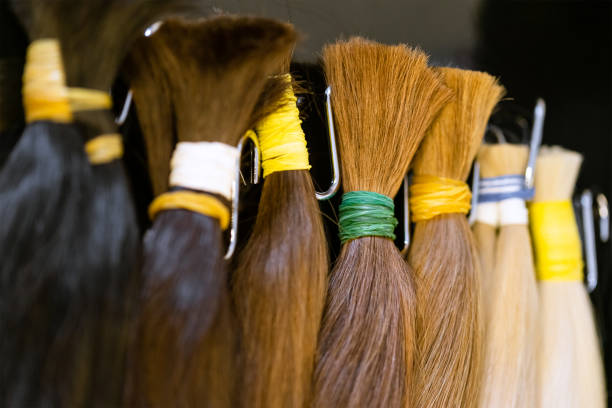 istock Bundles of natural human hair extensions samples 1296185249