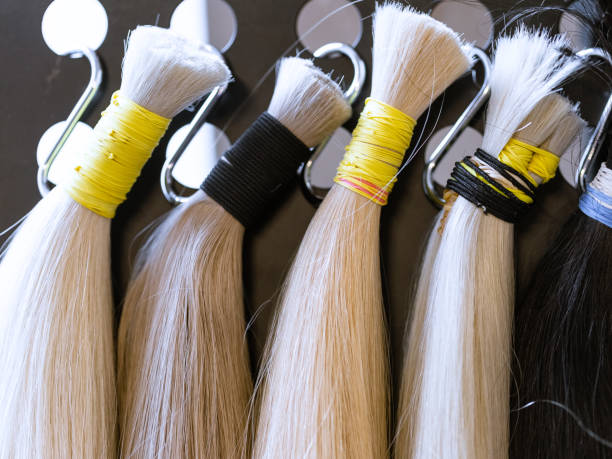 istock Bundles of natural human hair extensions samples 1296185258