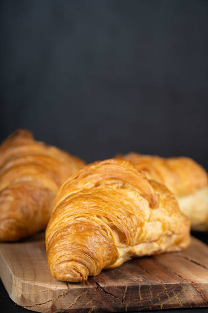 istock Delicious snack croissant on wood 1296185378