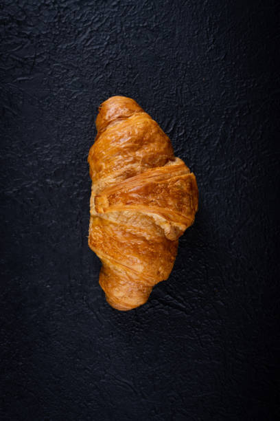 istock Delicious snack croissant on black 1296185978