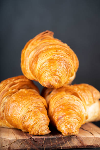 istock Delicious snack croissant on wood 1296186017