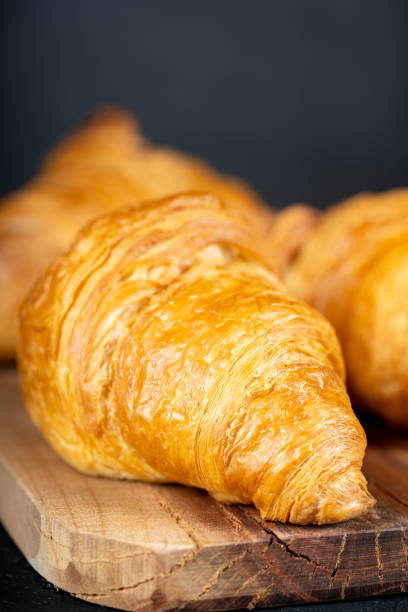 istock Delicious snack croissant on wood 1296186044