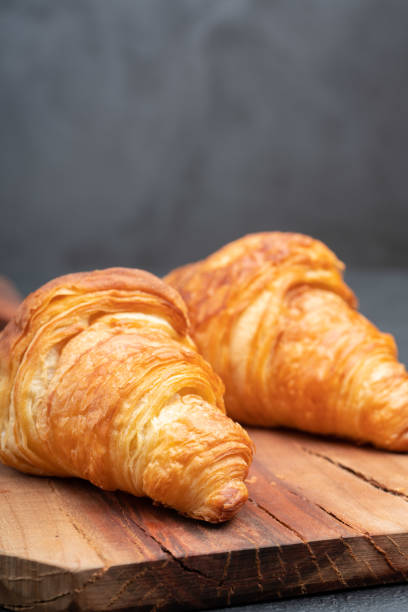 istock Delicious snack croissant on wood 1296186288