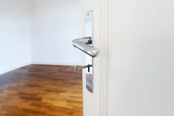 A silver door knob in a door
