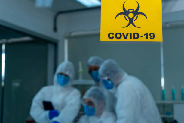 istock Group of four Asian medical scientists wearing PPE protective suits working with blood sample in laboratory.  Healthcare and medicine concept. virus pandemic concept. 1296187571