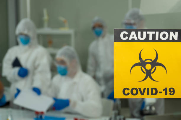 istock Group of four Asian medical scientists wearing PPE protective suits working with blood sample in laboratory.  Healthcare and medicine concept. virus pandemic concept. 1296187572