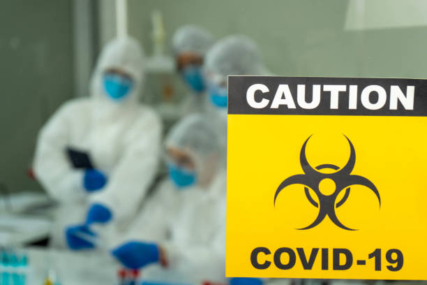 istock Group of four Asian medical scientists wearing PPE protective suits working with blood sample in laboratory.  Healthcare and medicine concept. virus pandemic concept. 1296187604