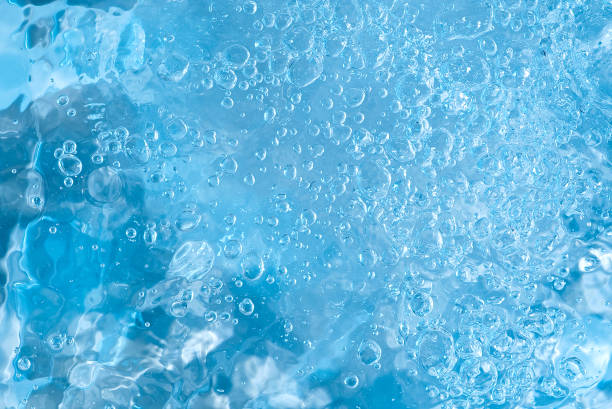 istock blue water abstract background. water surface with air bubbles background 1296189294