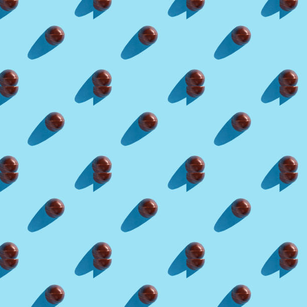istock round chocolate candy on a blue background in the form of patterns 1296190881