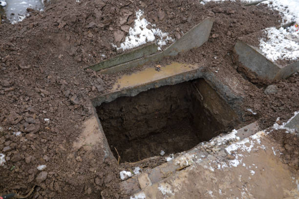 istock Empty grave in a cemetery during a cold and snowy winter day. 1296191722