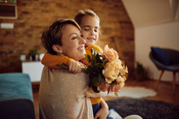 istock Happy mother and daughter embracing at home. 1296192437
