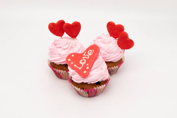 istock Valentine's Day. Cupcakes with hearts on a white background for Valentine's Day. 1296193172