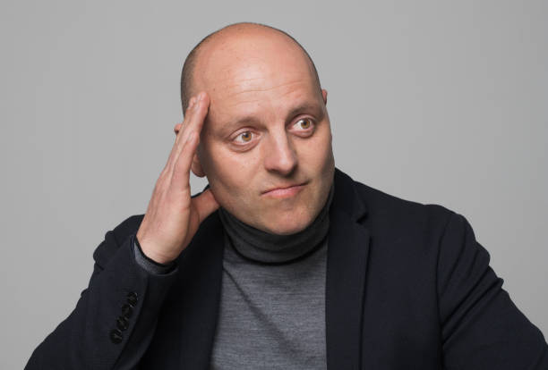 istock Portrait of thoughtful mature man 1296194265