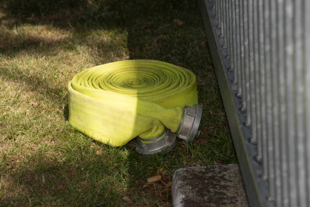 a fire hose to extinguish fires and flames, fire fighting equipment