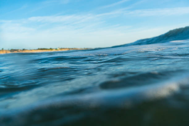 istock Breaking Waves and spray, white water and light reflected on the surface of the water 1296195385