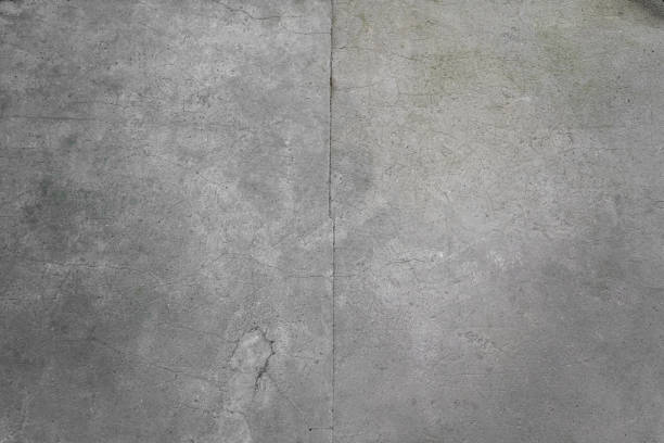 Old wall rough surface with residues of light paint or adhesive. Iregular pattern, abstract background.