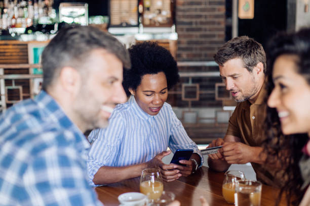 istock Colleagues banking online at the cafe 1296195677