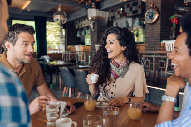 istock Group of colleagues drinking coffee together after work 1296195702