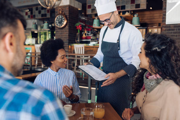 istock Group of colleagues ordering their lunch at the restaurant 1296195713