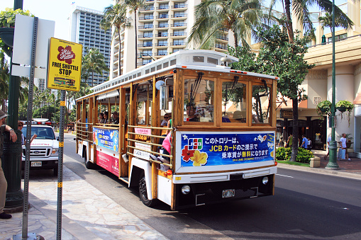 Waikiki, HI, USA - April 28, 2008: The trolley bus is a popular transportation for tourists in Waikiki.