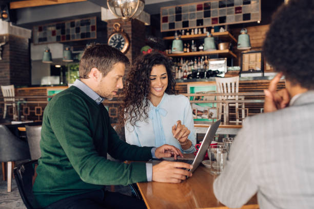 istock Business group cooperating at the cafe 1296196549