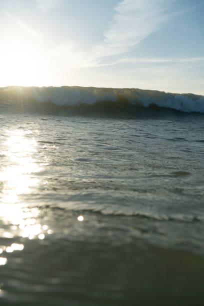 istock Breaking Waves and spray, white water and light reflected on the surface of the water 1296198345
