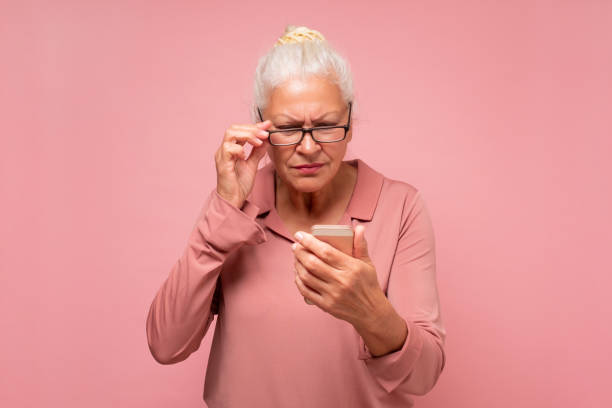 istock Confused senior woman with wrinkles is using her smartphone sending a messag 1296198633