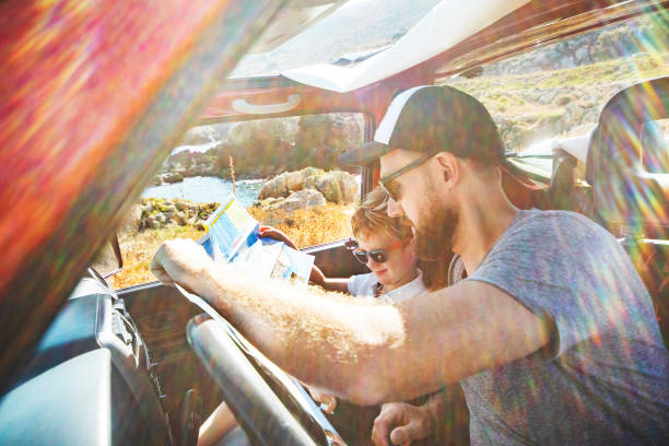 istock Road trip. Father and son travelling together by car 1296199655