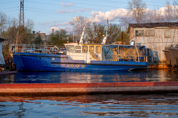 istock small pleasure boat at the pier on the river 1296199925