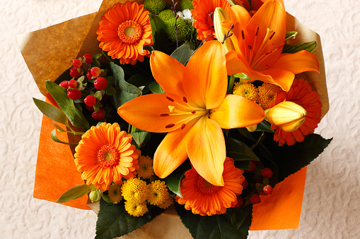Beautiful bouquet of various orange flowers.
