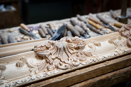 November 26, 2020 Lyon, Dijon, Burgundy, France: detail of the work of a supplier of frames, wood sculptor