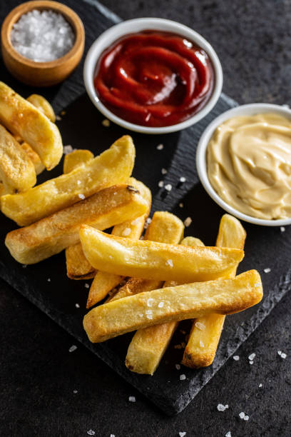 istock Big french fries. Fried potato chips. 1296202401
