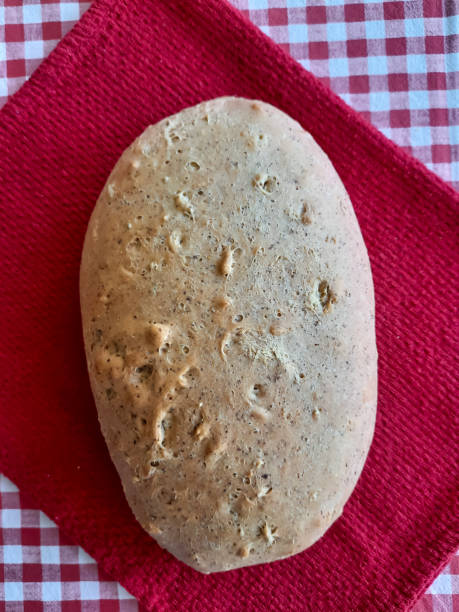 istock Bread, homemade cakes. Fresh bread on a tablecloth on the table. Food and drinks. 1296203513