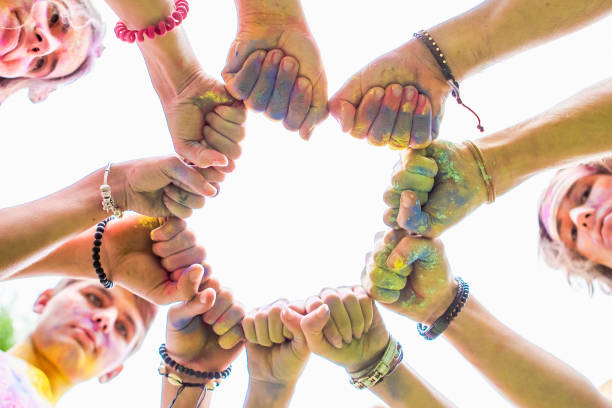 istock friends hands close up in holi paint 1296203520
