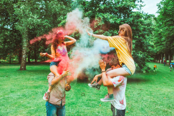istock young happy friends at holi fest 1296203573
