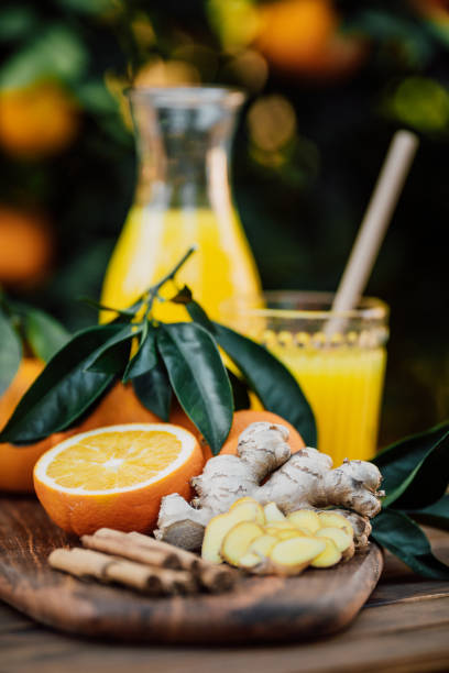 istock Freshly squeezed orange juice of untreated Bio oranges with Cinnamon sticks and sliced ginger 1296203724