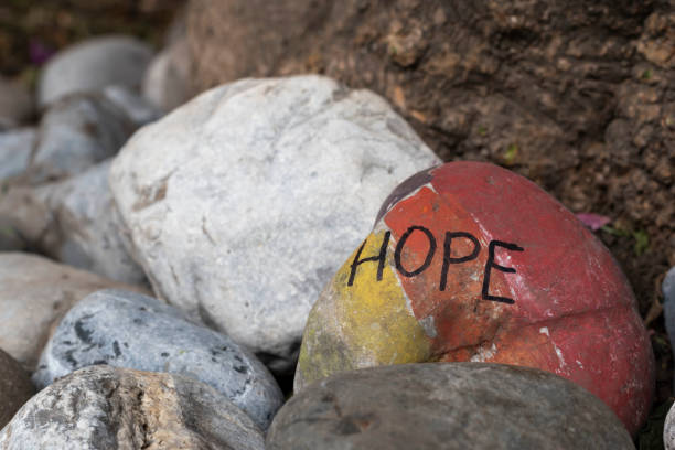 istock Hope text message written on a stone in the park 1296204108