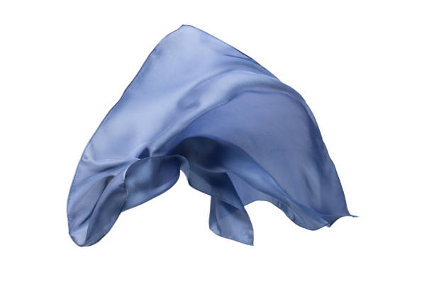 istock Flowing blue silk scarf isolated on white background. 1296206107