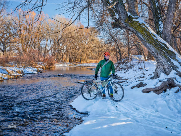 istock cyclist on a river shor in winter scenery 1296208450