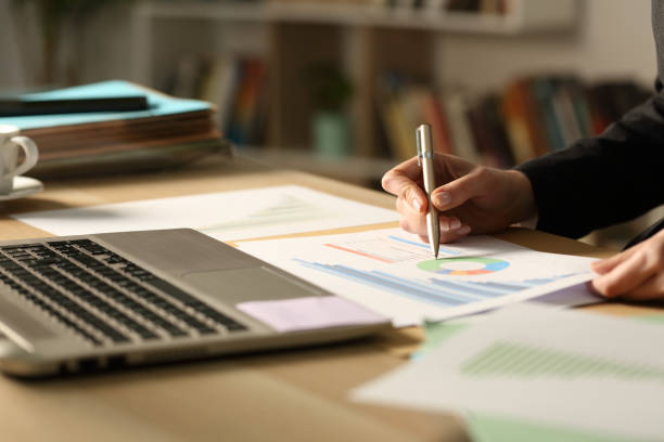 istock Entrepreneur hand working in the night at home 1296209645