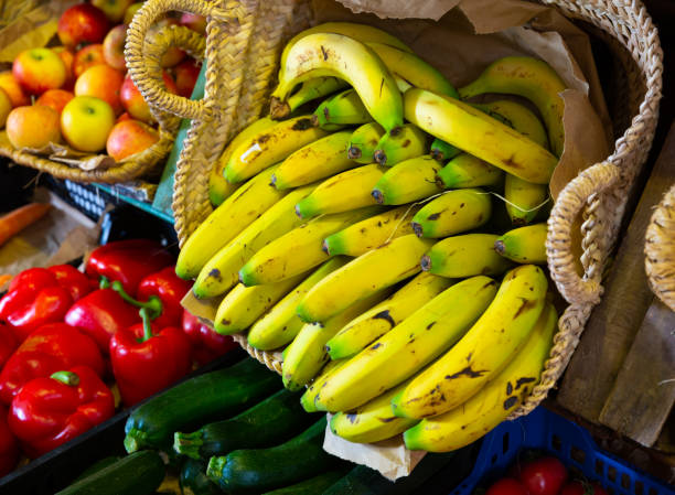 istock Showcase with ripe yellow bananas in greengrocery 1296210437