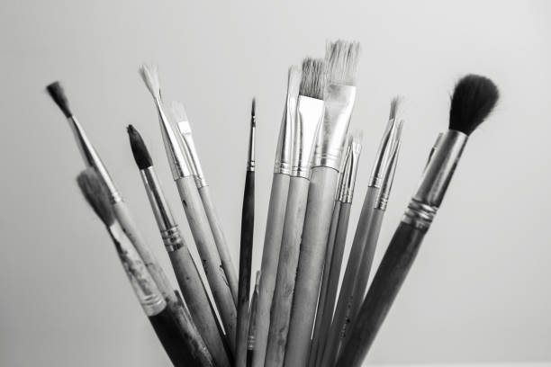 Black and white of painting brushes on white background.