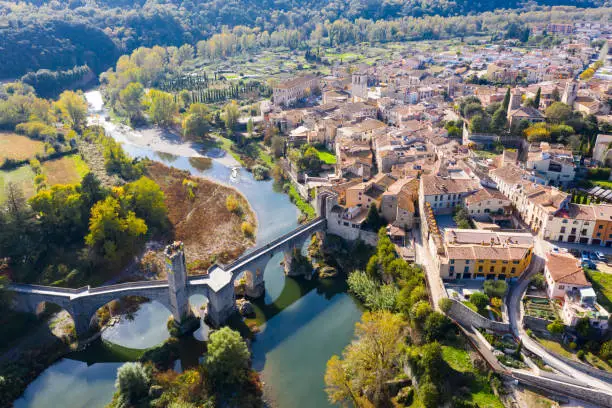 View from drone of medieval Spain town of Besalu with Romanesque arched bridge